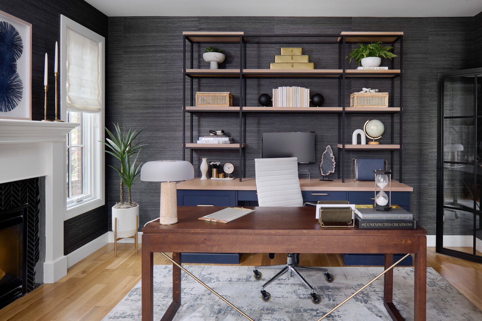 Home office with charcoal grasscloth walls, open oak-and-steel shelving and a wood desk in the Bonnie Brae remodel, Denver.