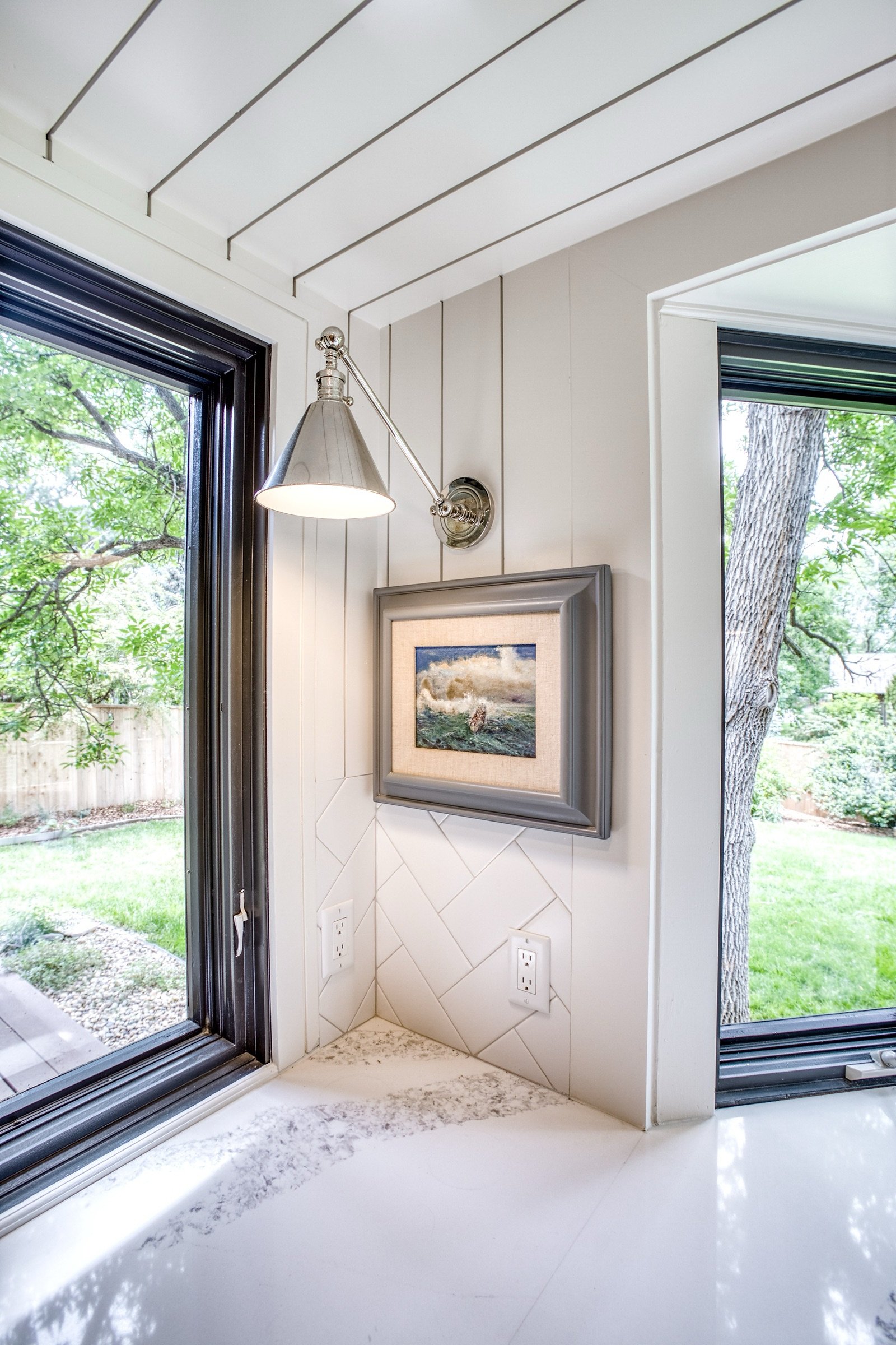 Kitchen perimeter with quartz counters and window to the trees, Fulton Street whole house renovation in Greenwood Village