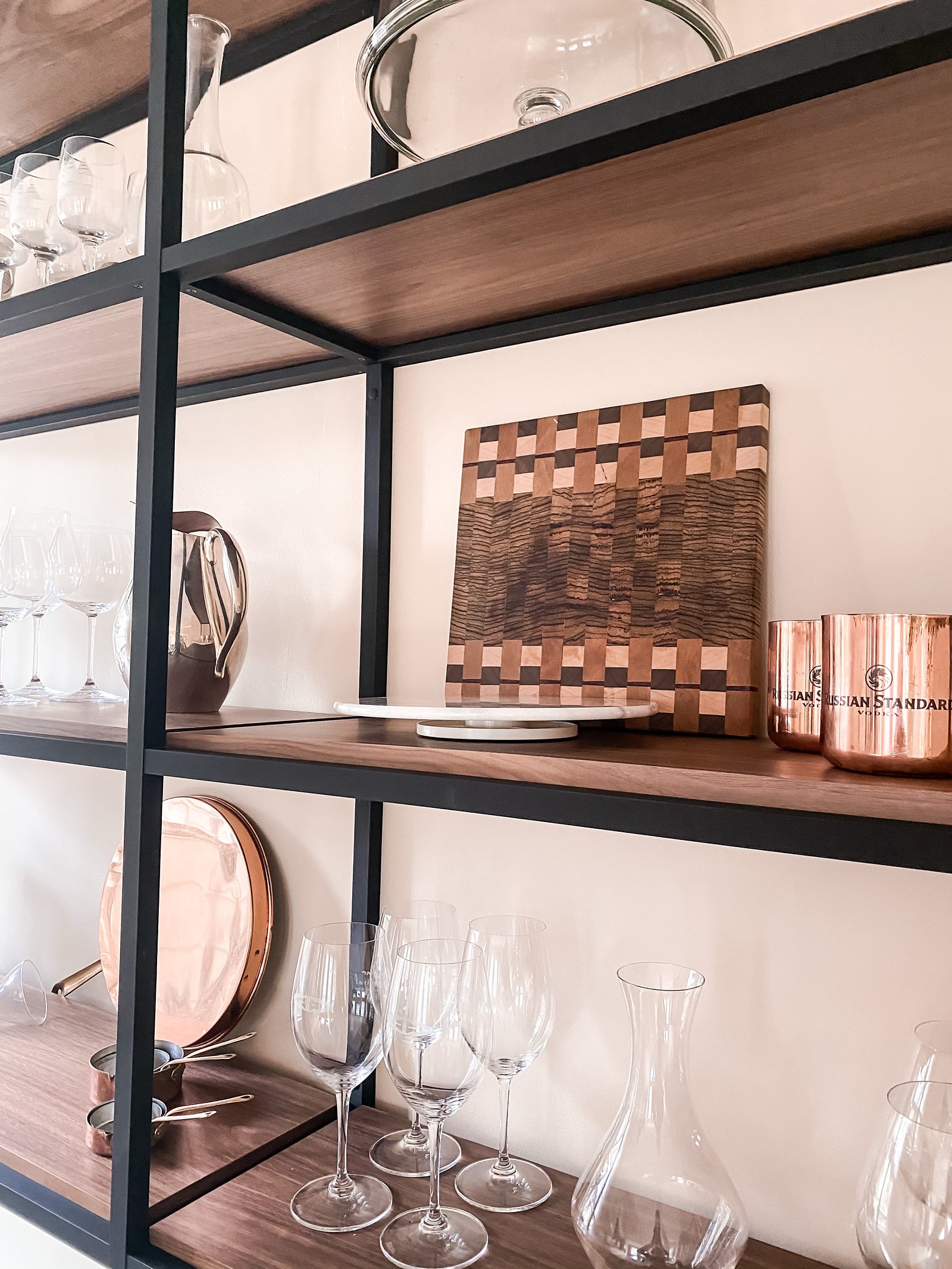 Open shelving styled with cutting boards and copper, historic Colorado Springs kitchen remodel