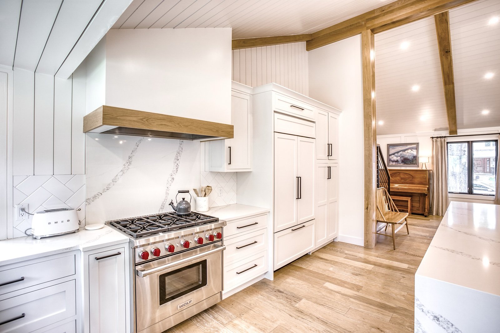 Range wall with white oak hood shelf and pro-style range, Fulton Street whole house renovation in Greenwood Village