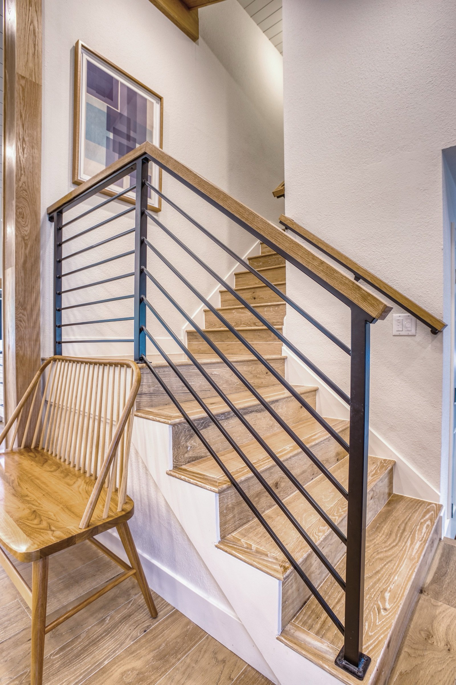 Stair detail with modern spindle rail, Fulton Street whole house renovation in Greenwood Village