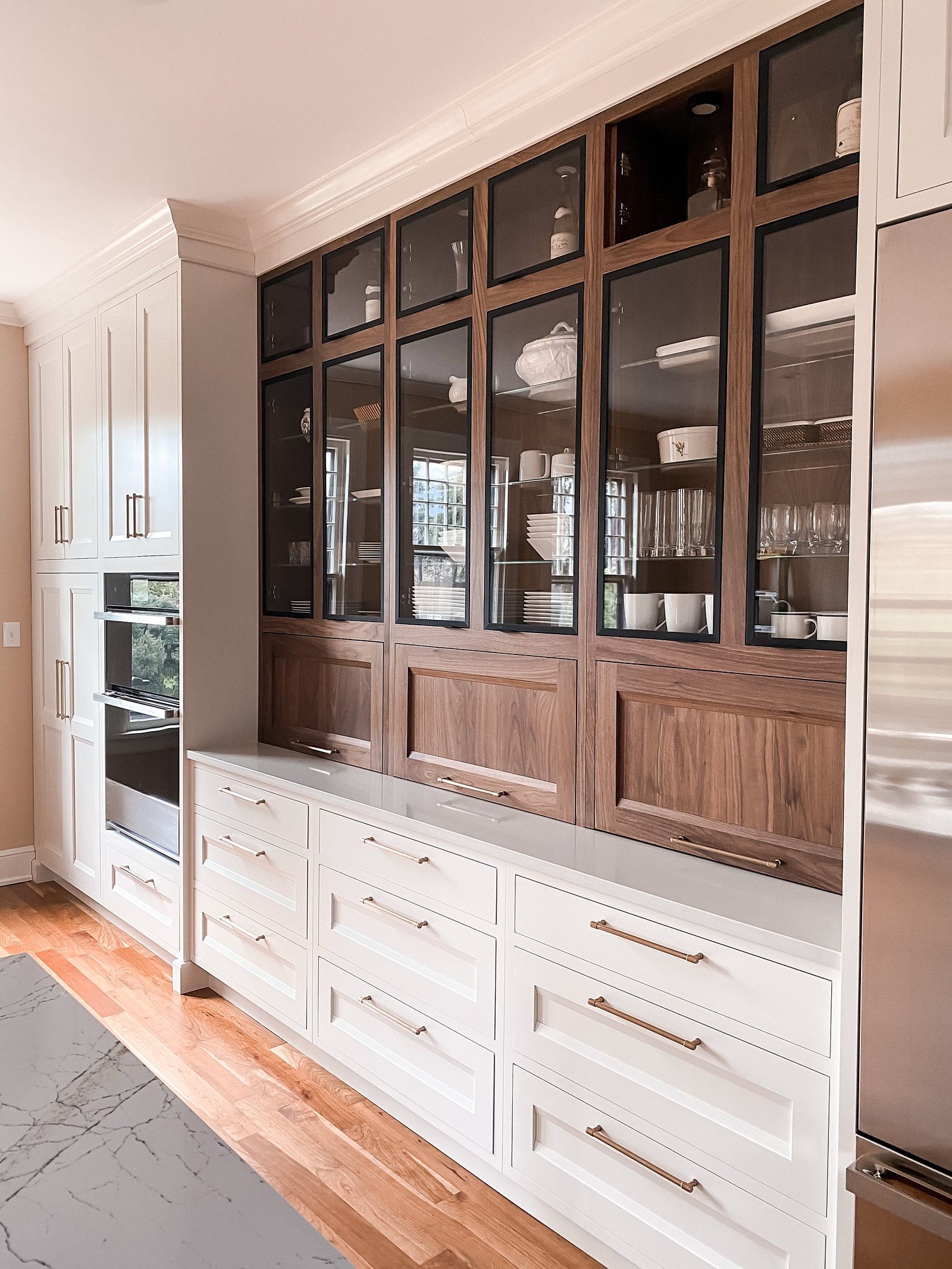 Full run of the two-tone cabinet wall with integrated wall ovens, historic Colorado Springs kitchen remodel