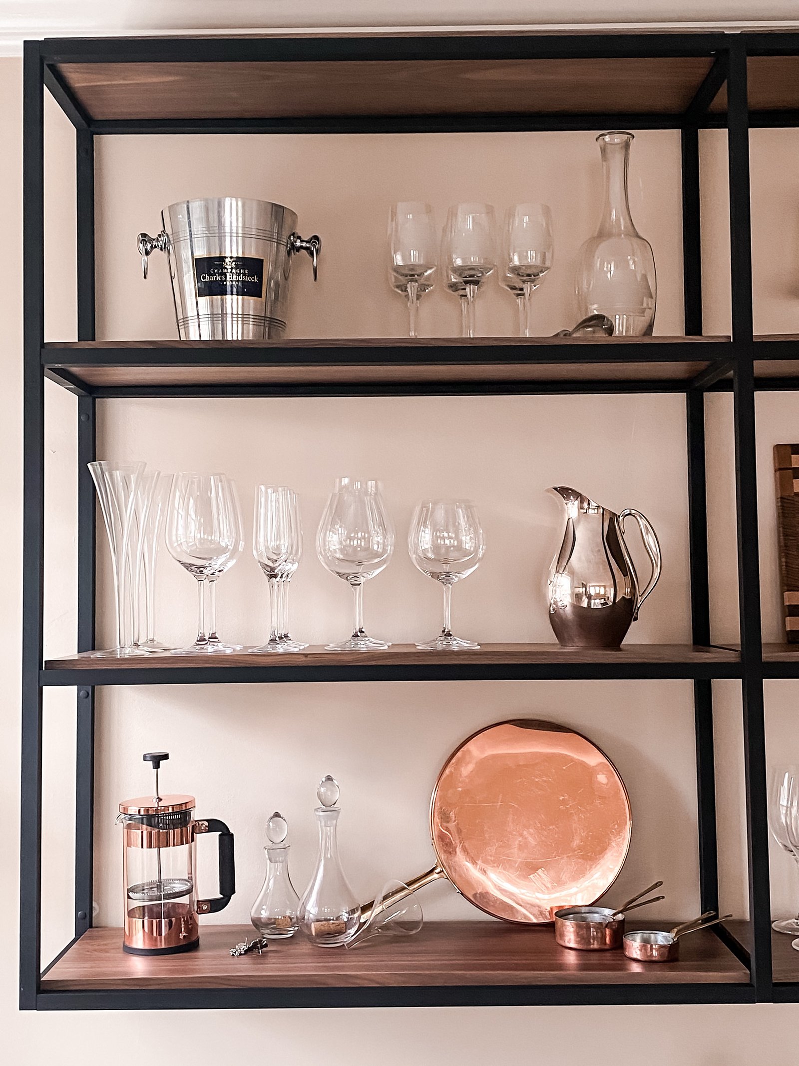 Metal shelf unit with copper cookware and barware, historic Colorado Springs kitchen remodel