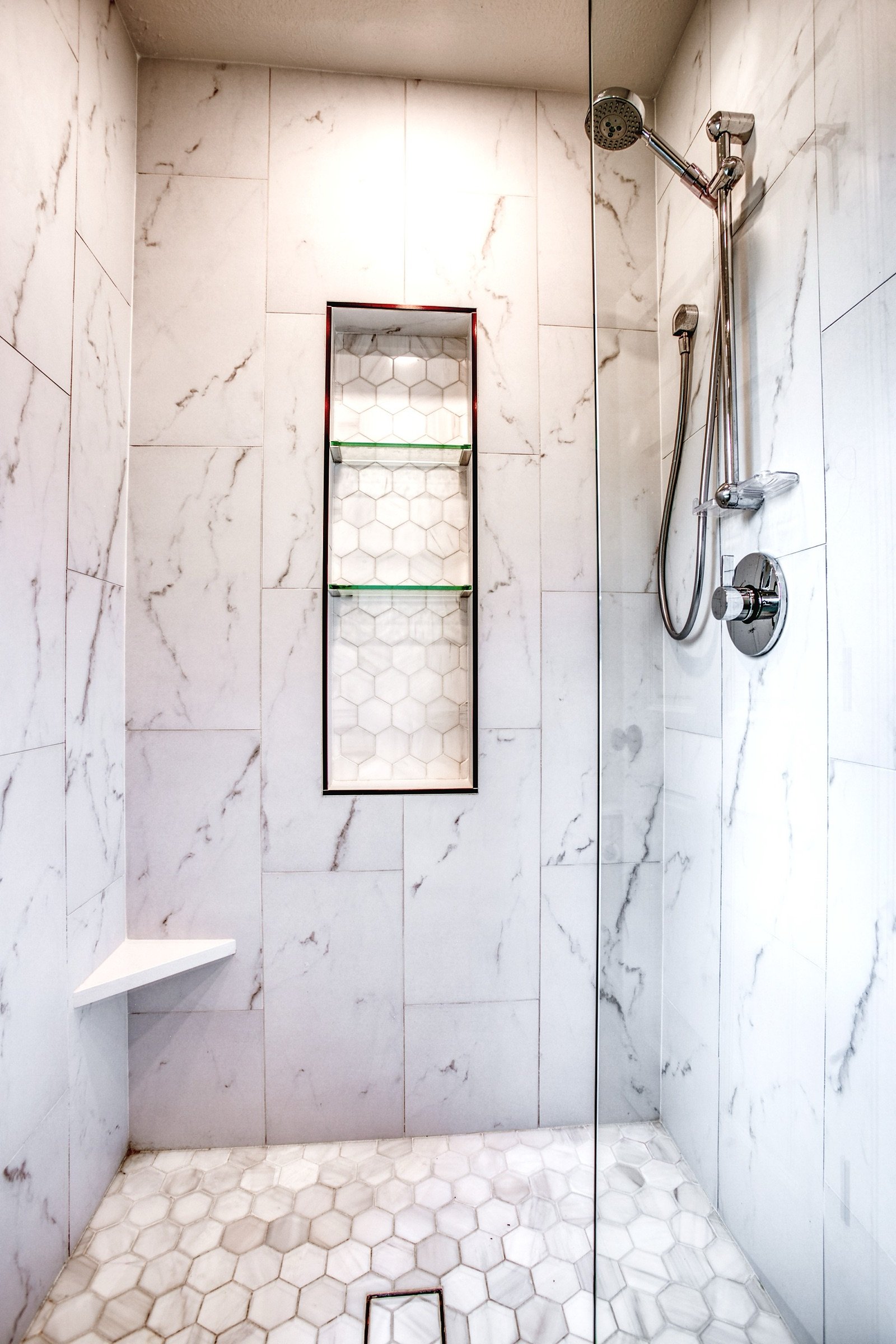 Primary vanity wall with backlit mirrors, Fulton Street whole house renovation in Greenwood Village