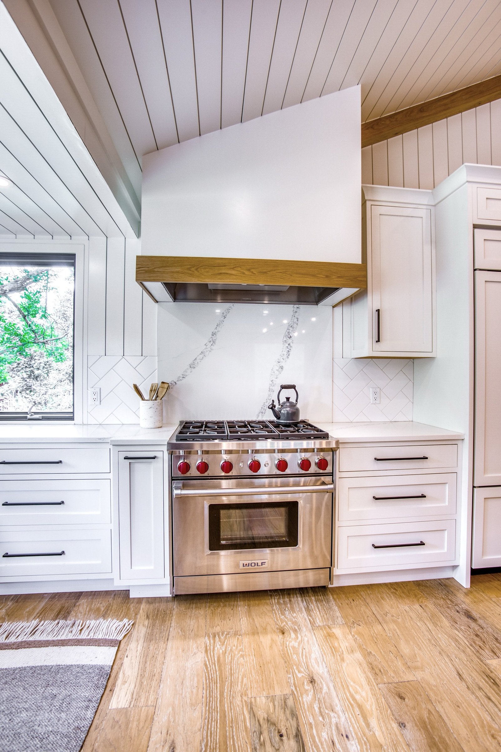 Kitchen corner with shiplap vault and black-framed windows, Fulton Street whole house renovation in Greenwood Village
