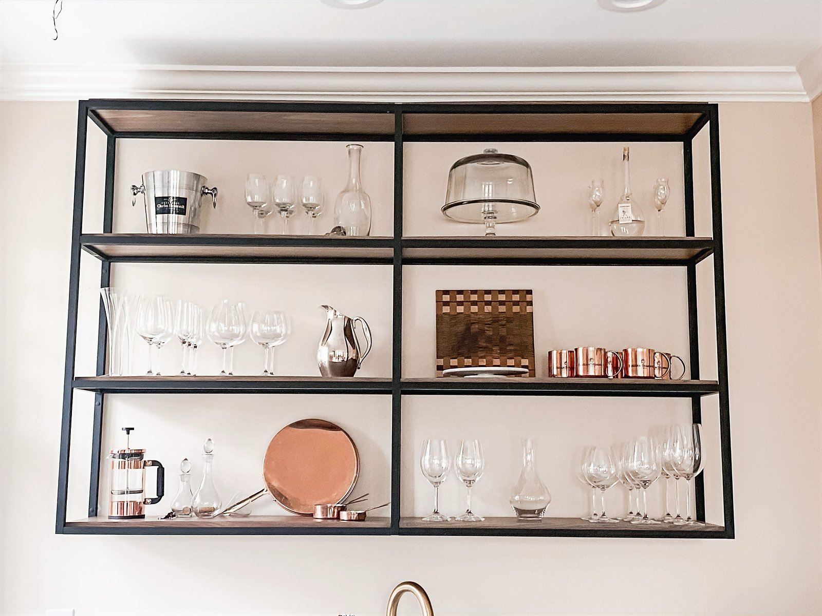 Black metal open shelving styled with copper and glassware, historic Colorado Springs kitchen remodel