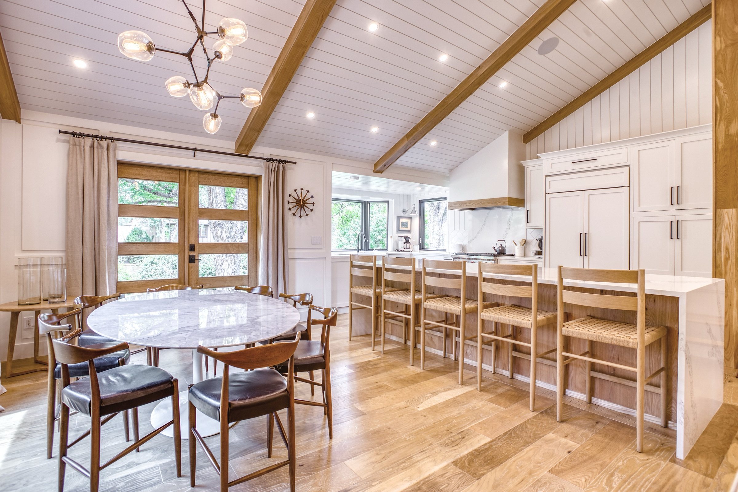 Vaulted kitchen and dining with white oak beams, shiplap ceiling, and waterfall island, Fulton Street whole house renovation in Greenwood Village