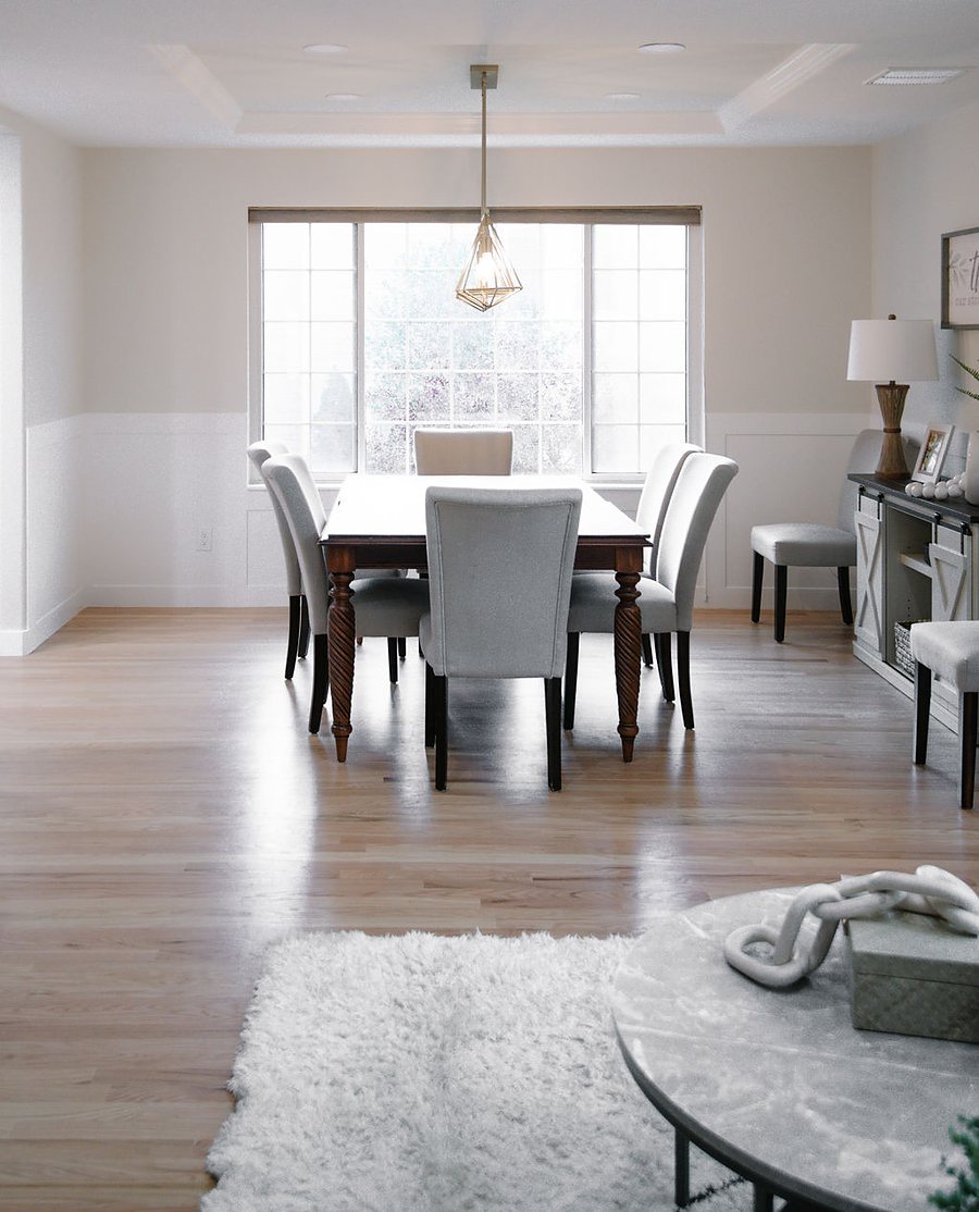 Formal dining room with white table and soft flokati rug, Stonegate main floor renovation in Parker, Colorado