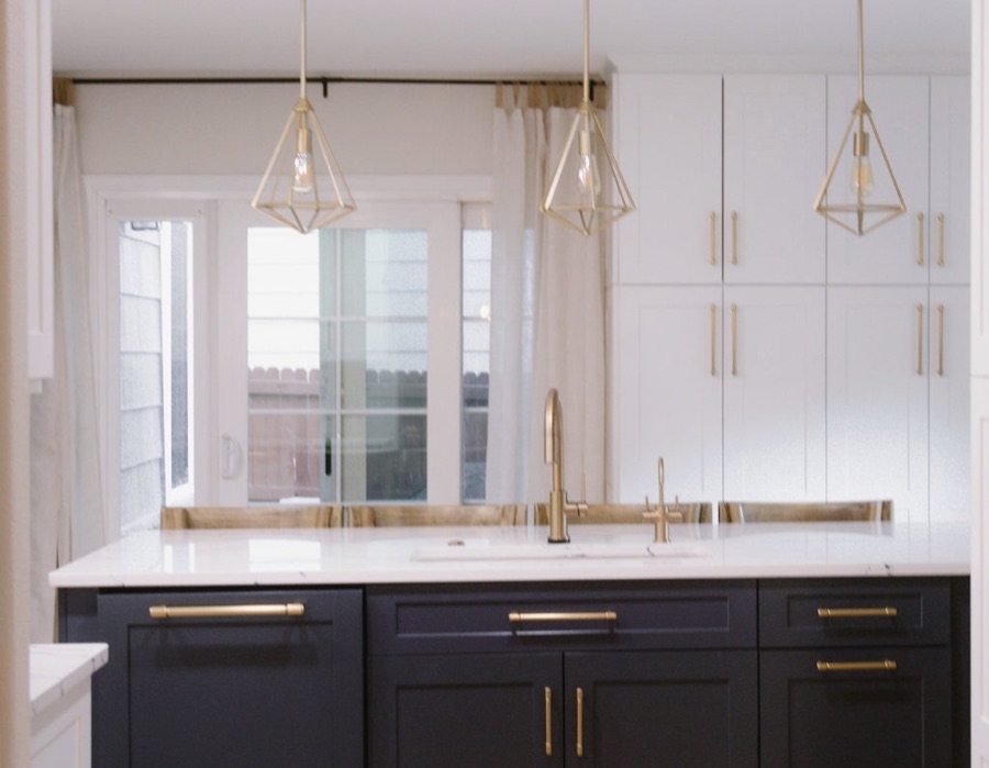 Kitchen sink wall with white cabinets to the ceiling and gold accents, Stonegate main floor renovation in Parker, Colorado