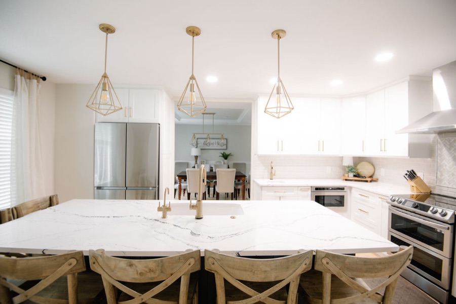 Kitchen overview from the island with layered lighting, Stonegate main floor renovation in Parker, Colorado